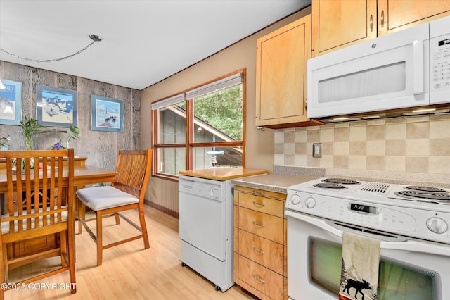 12145 Rainbow Ave, Anchorage, AK 99516 - kitchen with white appliances, light wood finished floors, tasteful backsplash, light countertops, and light brown cabinets
