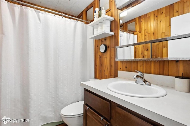 4733 Becharof St, Anchorage, AK 99507 - bathroom featuring wood walls, vanity, and curtained shower