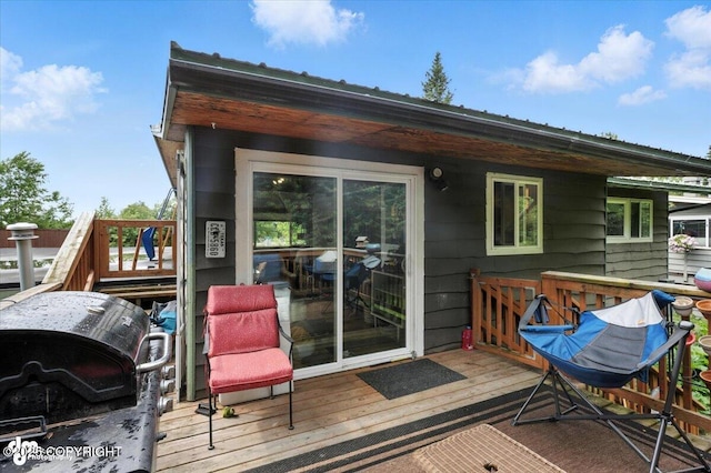 4733 Becharof St, Anchorage, AK 99507 - wooden deck with a grill