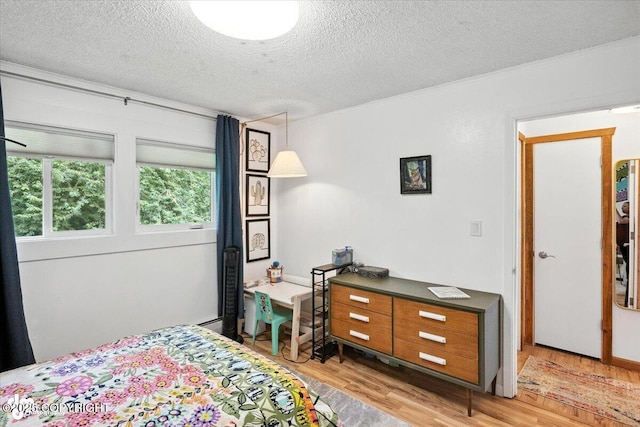 4733 Becharof St, Anchorage, AK 99507 - bedroom with light wood finished floors, a textured ceiling, and crown molding
