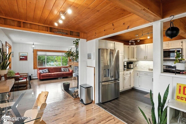 4733 Becharof St, Anchorage, AK 99507 - kitchen with appliances with stainless steel finishes, wooden ceiling, dark wood-style flooring, decorative backsplash, and light countertops