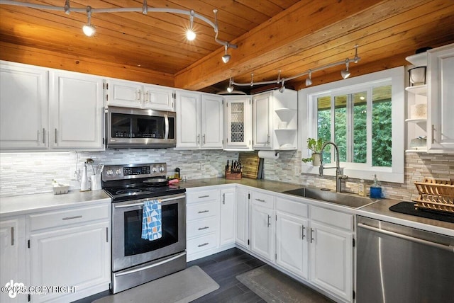 4733 Becharof St, Anchorage, AK 99507 - kitchen featuring stainless steel appliances, open shelves, track lighting, white cabinetry, and a wooden ceiling with exposed beams