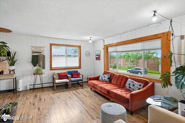 4733 Becharof St, Anchorage, AK 99507 - living room featuring a textured ceiling, wood-type flooring, and wood walls