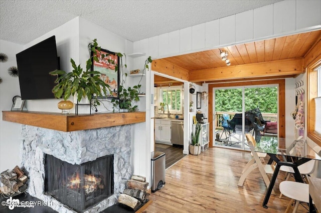 4733 Becharof St, Anchorage, AK 99507 - living room featuring wood finished floors and a stone fireplace