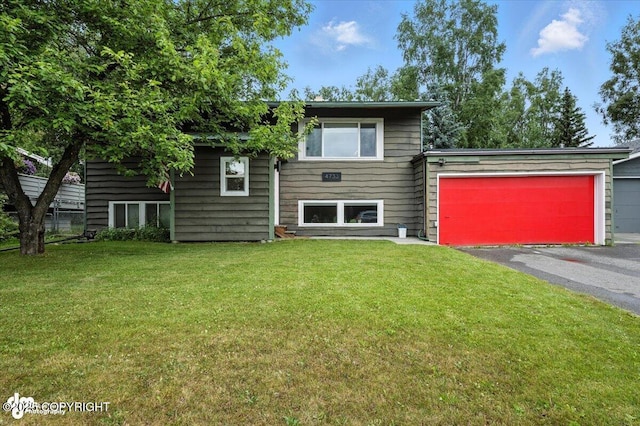 4733 Becharof St, Anchorage, AK 99507 - view of front of property with a garage, driveway, and a front lawn