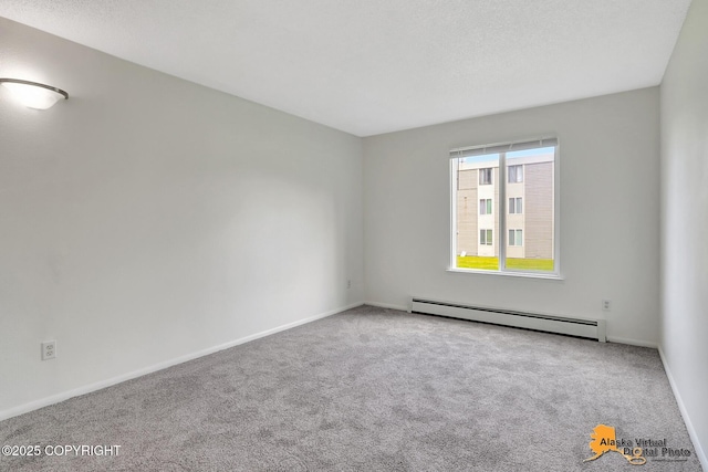 4650 Reka Dr # F6, Anchorage, AK 99508 - carpeted empty room with a baseboard heating unit and baseboards