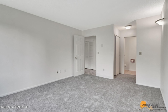 4650 Reka Dr # F6, Anchorage, AK 99508 - unfurnished bedroom featuring carpet flooring and baseboards