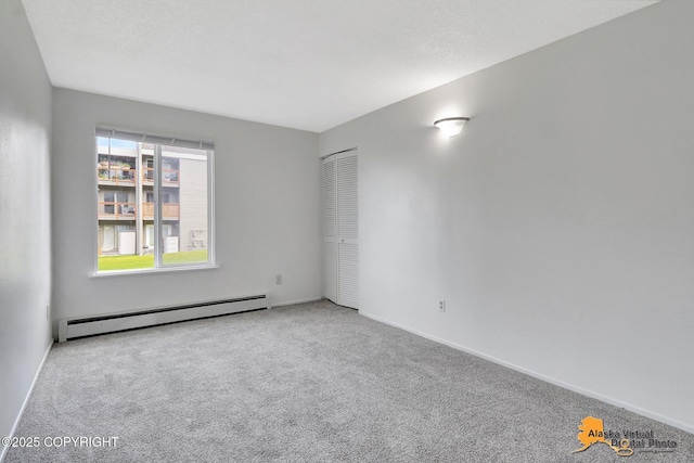 4650 Reka Dr # F6, Anchorage, AK 99508 - spare room featuring baseboard heating and carpet