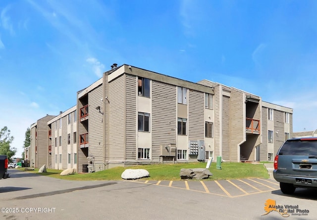 4650 Reka Dr # F6, Anchorage, AK 99508 - view of building exterior featuring uncovered parking