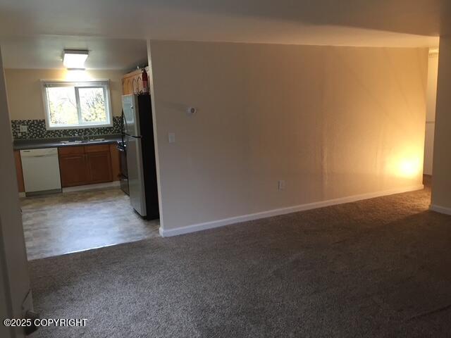 420 E 14th Ave, Anchorage, AK 99501 - unfurnished room featuring light carpet and a sink