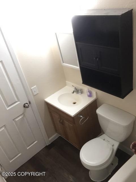 420 E 14th Ave, Anchorage, AK 99501 - bathroom featuring vanity and wood finished floors