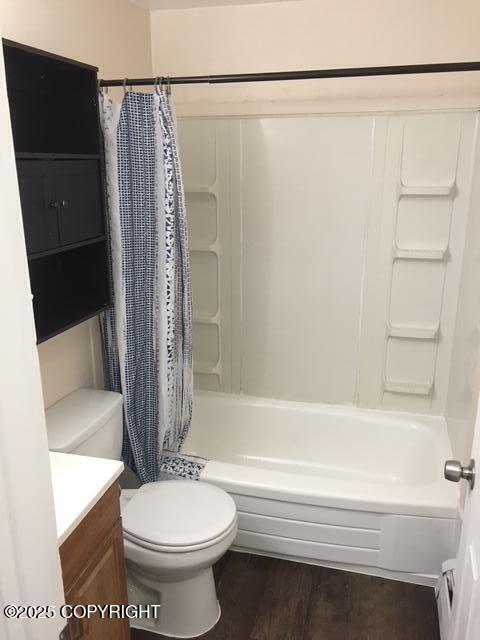 420 E 14th Ave, Anchorage, AK 99501 - full bath featuring vanity, shower / bathtub combination with curtain, and wood finished floors