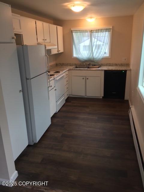 420 E 14th Ave, Anchorage, AK 99501 - kitchen with freestanding refrigerator, dishwasher, dark wood-style flooring, white cabinetry, and baseboard heating