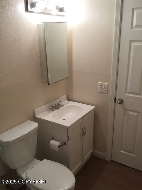 420 E 14th Ave, Anchorage, AK 99501 - half bath featuring vanity and wood finished floors