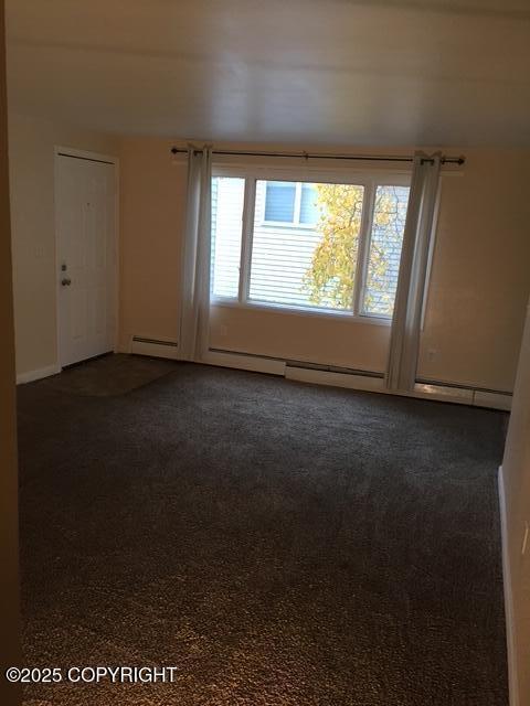 420 E 14th Ave, Anchorage, AK 99501 - spare room featuring dark colored carpet