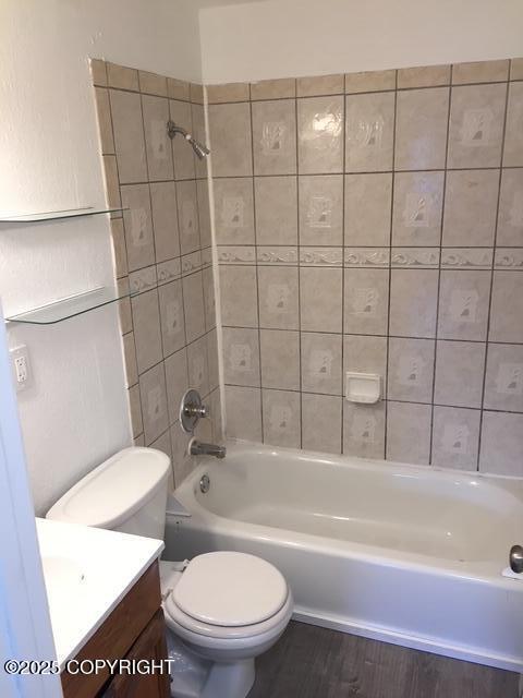 420 E 14th Ave, Anchorage, AK 99501 - full bathroom featuring vanity, bathing tub / shower combination, and wood finished floors