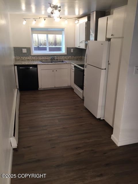 420 E 14th Ave, Anchorage, AK 99501 - kitchen with range, black dishwasher, freestanding refrigerator, dark wood-style flooring, and white cabinetry