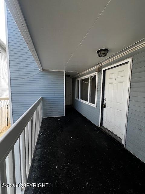 420 E 14th Ave, Anchorage, AK 99501 - view of exterior entry with a balcony