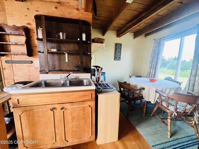 32425 Sterling Hwy, Anchor Point, AK 99556 - kitchen with light wood-type flooring, a wooden ceiling with exposed beams, open shelves, and light countertops