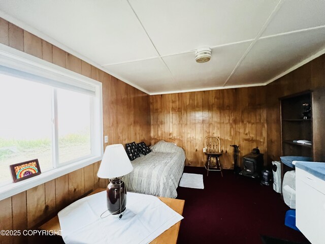 32425 Sterling Hwy, Anchor Point, AK 99556 - bedroom with wood walls and dark colored carpet