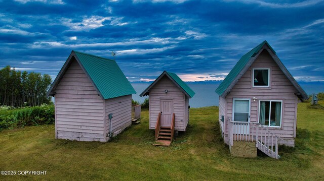 32425 Sterling Hwy, Anchor Point, AK 99556 - back of property with a yard, entry steps, and a storage unit