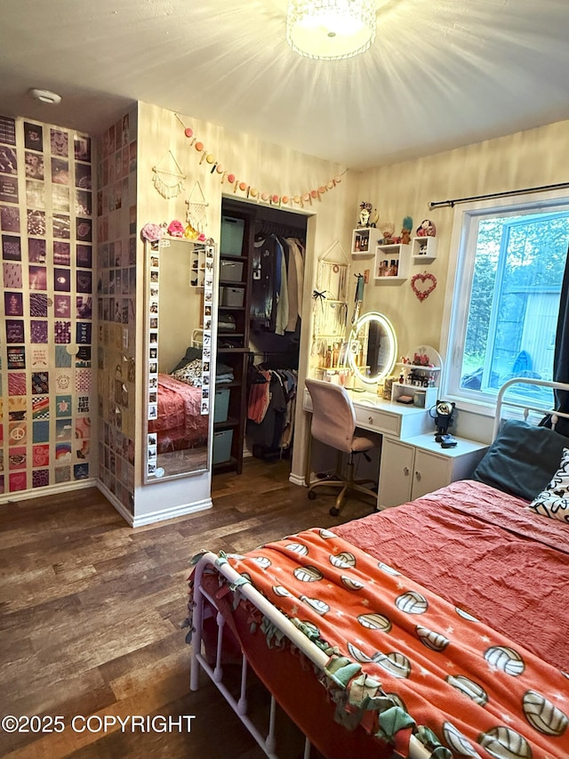 54110 Field Dr, Nikiski/North Kenai, AK 99611 - bedroom with wood finished floors, a closet, and a desk
