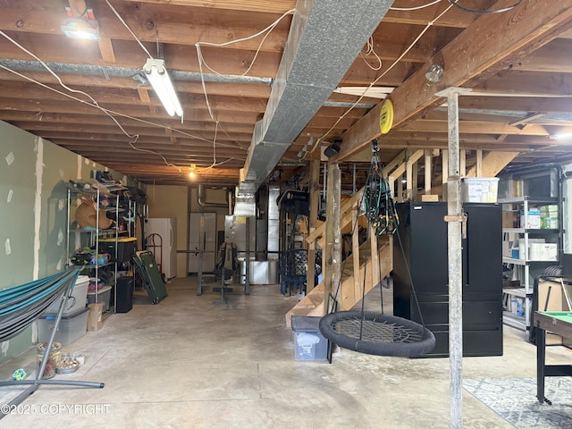 54110 Field Dr, Nikiski/North Kenai, AK 99611 - unfinished basement with heating unit and freestanding refrigerator