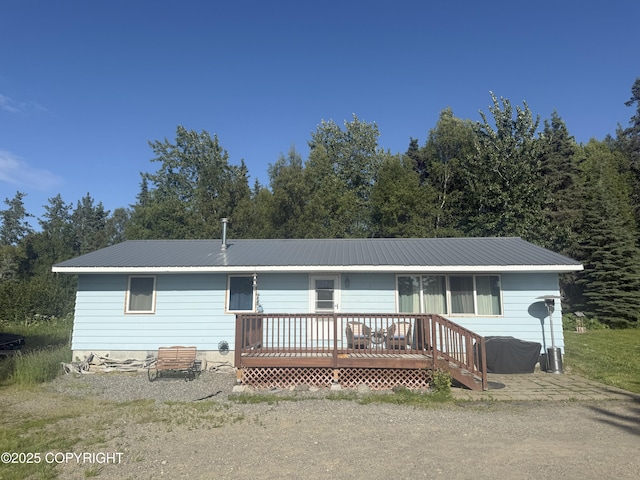 54110 Field Dr, Nikiski/North Kenai, AK 99611 - view of front of home featuring a metal roof and a deck