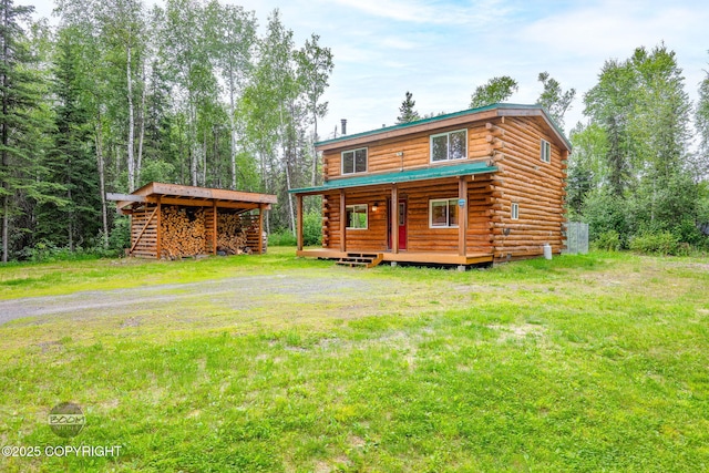 1291 N Rainbow Park Dr, Wasilla, AK 99623 - rear view of property featuring log exterior and a lawn