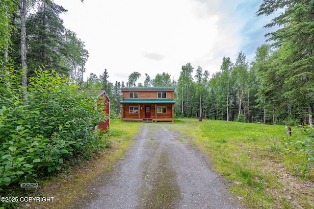 1291 N Rainbow Park Dr, Wasilla, AK 99623 - log home featuring dirt driveway and a porch