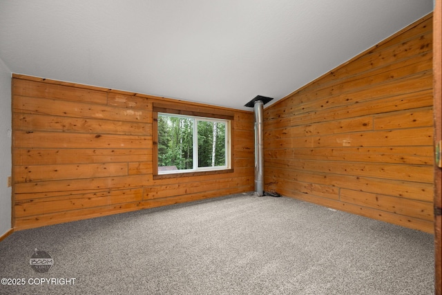 1291 N Rainbow Park Dr, Wasilla, AK 99623 - spare room with lofted ceiling, wood walls, and carpet