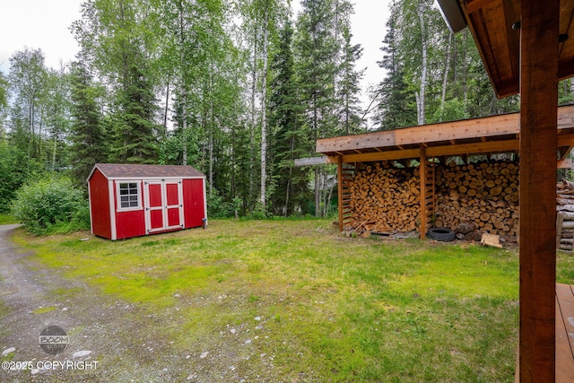 1291 N Rainbow Park Dr, Wasilla, AK 99623 - view of green lawn featuring a storage unit