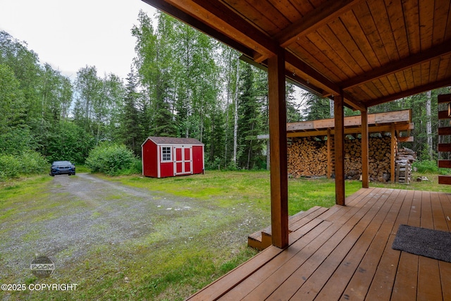1291 N Rainbow Park Dr, Wasilla, AK 99623 - deck with a storage shed and a yard