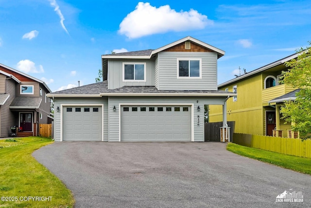 8126 Grayhawk Cir, Anchorage, AK 99507 - traditional home featuring driveway, a garage, roof with shingles, and board and batten siding