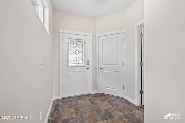8126 Grayhawk Cir, Anchorage, AK 99507 - entryway with stone finish floors and healthy amount of natural light