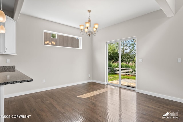8126 Grayhawk Cir, Anchorage, AK 99507 - unfurnished dining area with dark wood-type flooring and a chandelier