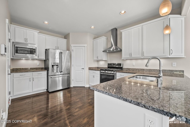 8126 Grayhawk Cir, Anchorage, AK 99507 - kitchen featuring appliances with stainless steel finishes, wall chimney exhaust hood, dark wood-style floors, dark stone counters, and white cabinetry