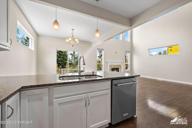 8126 Grayhawk Cir, Anchorage, AK 99507 - kitchen featuring open floor plan, white cabinetry, a chandelier, dishwasher, and beamed ceiling
