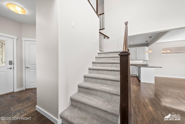 8126 Grayhawk Cir, Anchorage, AK 99507 - staircase featuring wood finished floors and baseboards