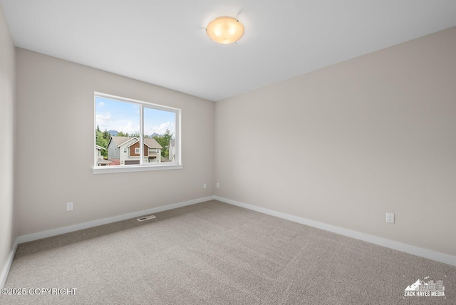 8126 Grayhawk Cir, Anchorage, AK 99507 - carpeted spare room with baseboards
