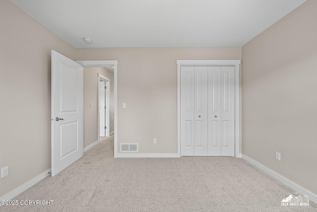 8126 Grayhawk Cir, Anchorage, AK 99507 - unfurnished bedroom with carpet floors and a closet