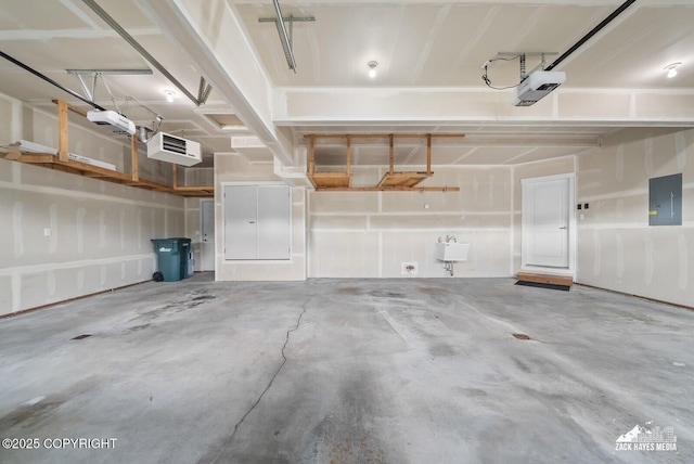 8126 Grayhawk Cir, Anchorage, AK 99507 - garage featuring electric panel and a garage door opener