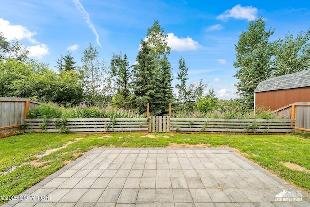 8126 Grayhawk Cir, Anchorage, AK 99507 - fenced backyard featuring a patio