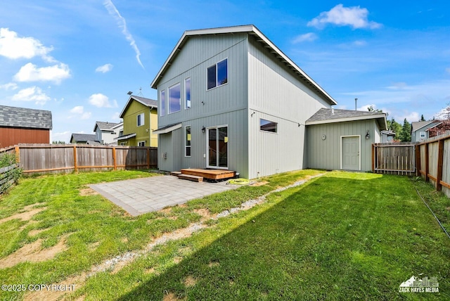 8126 Grayhawk Cir, Anchorage, AK 99507 - back of property featuring a patio area and a fenced backyard