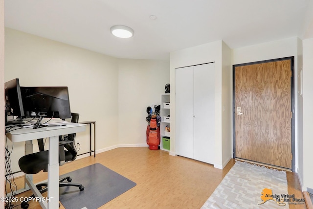 1201 Denali St Unit 210, Anchorage, AK 99501 - office area with light wood-style flooring and baseboards