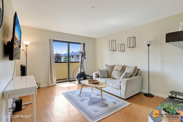 1201 Denali St Unit 210, Anchorage, AK 99501 - living area with light wood-style flooring