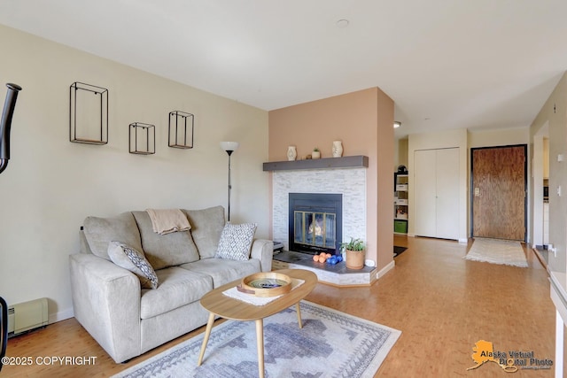 1201 Denali St Unit 210, Anchorage, AK 99501 - living room with wood finished floors and a stone fireplace