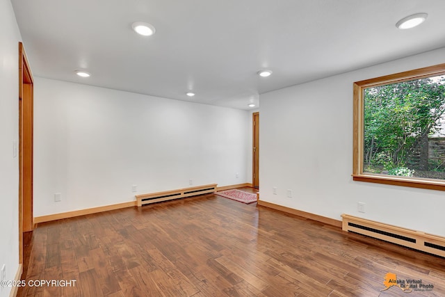 2641 W 27th Ave, Anchorage, AK 99517 - unfurnished room with a baseboard radiator, wood finished floors, and recessed lighting