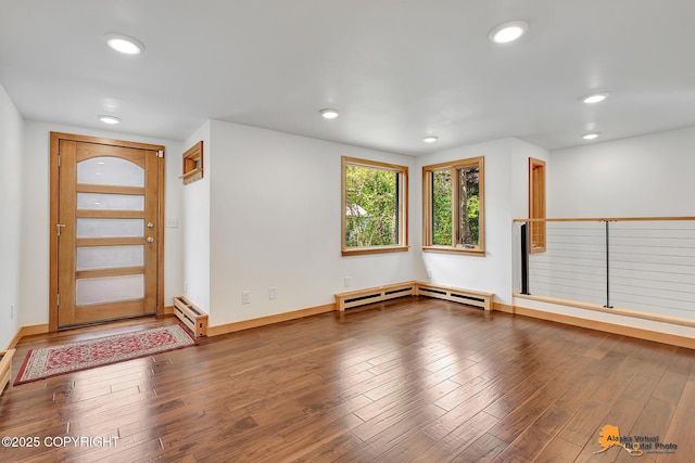 2641 W 27th Ave, Anchorage, AK 99517 - foyer entrance with recessed lighting, a baseboard heating unit, wood finished floors, and baseboard heating