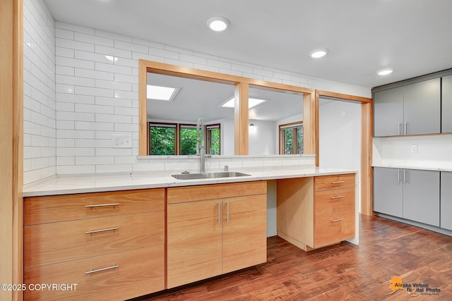2641 W 27th Ave, Anchorage, AK 99517 - kitchen with backsplash, light countertops, dark wood finished floors, and recessed lighting